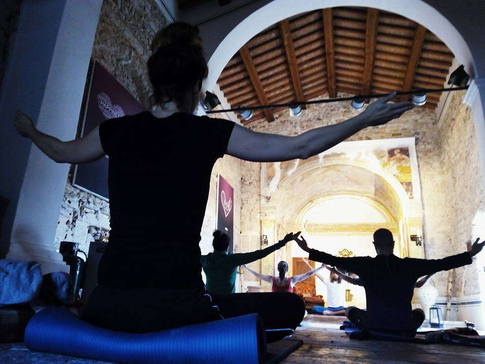 Yoga session during trauma retreat for woman inside San Flaviano.