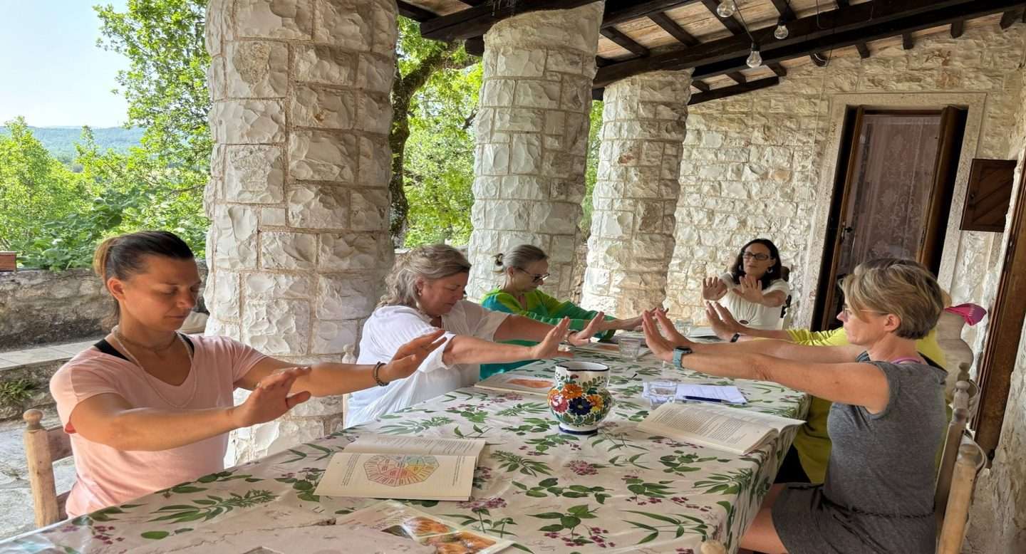 Women practising somatic therapy guided by Tess Hunneybell at Healing Trauma Retreat, San Flaviano monastery, Umbria, Italy